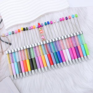 smooth 1.0mm black ink writing demonstration with rhinestone empty barrel pen on notebook paper