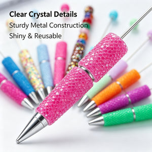 Close-up of a fluorescent pink rhinestone pen with sparkling crystal decorations and shiny barrel