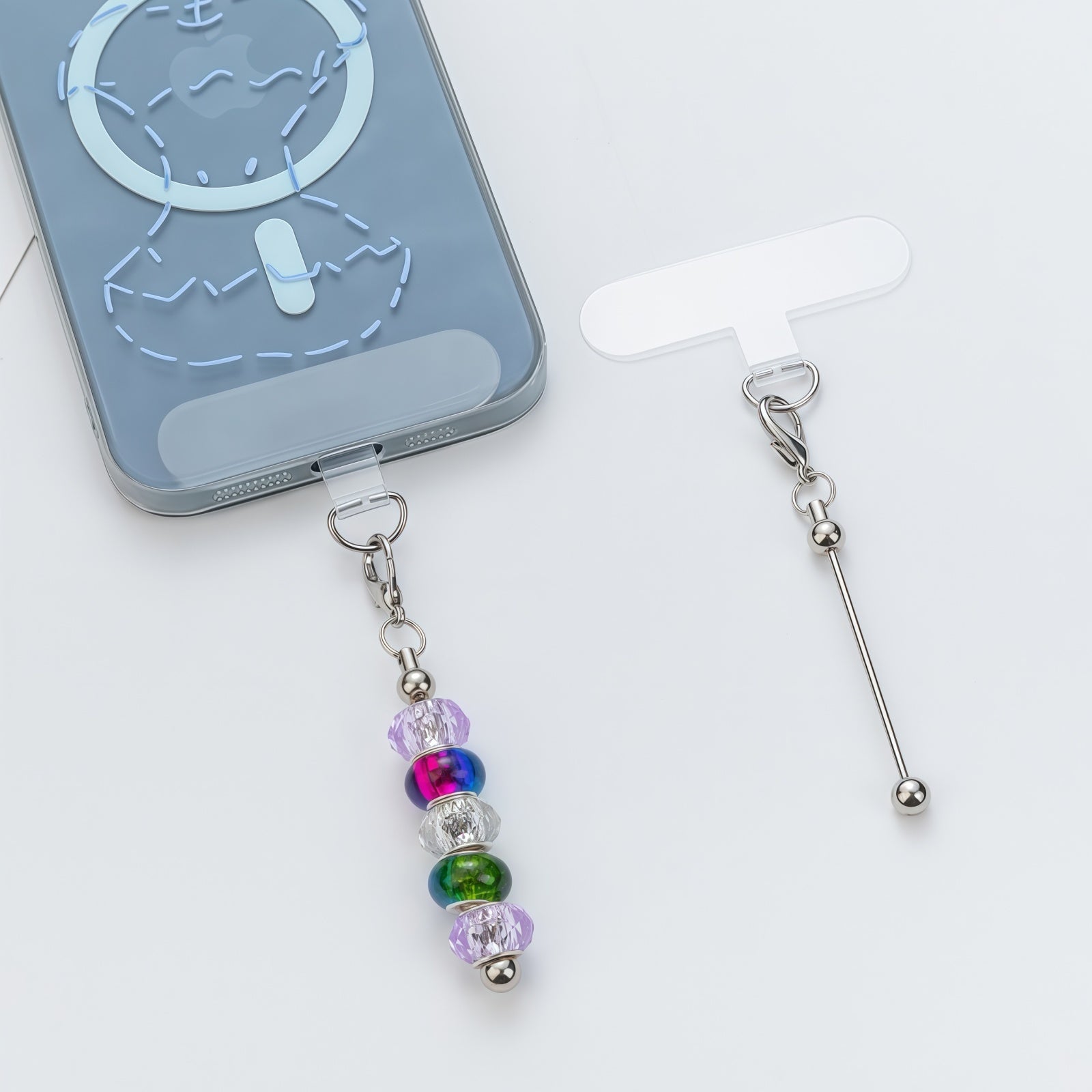 Lanyard clip placed between phone and case showing no-adhesive installation method with metal bar exposed